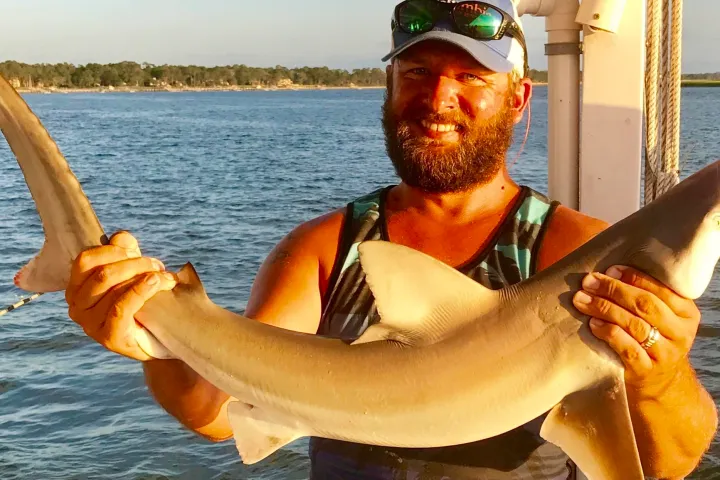 Man holding shark